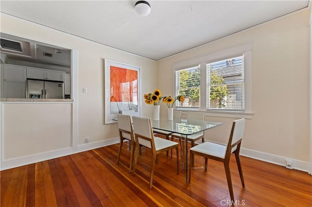 10633 Chiquita St, Toluca Lake, CA 91602 - dining space featuring wood-type flooring and baseboards