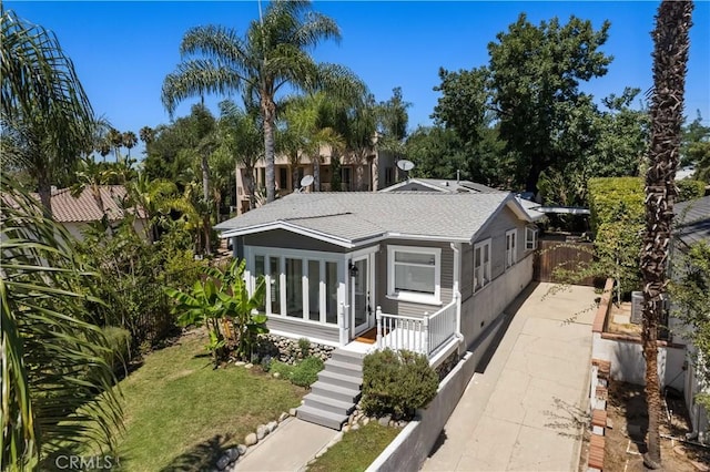 10633 Chiquita St, Toluca Lake, CA 91602 - view of front of house featuring a shingled roof
