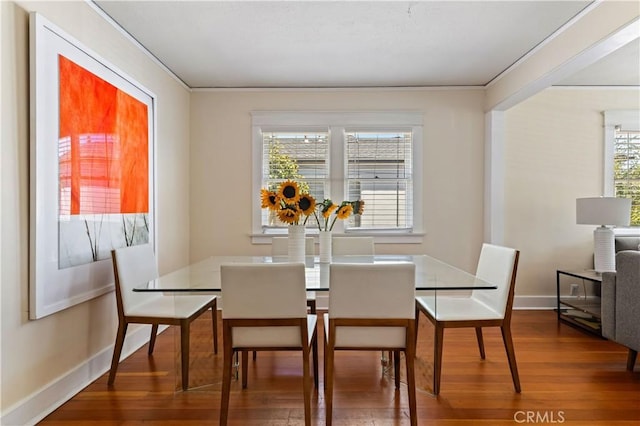 10633 Chiquita St, Toluca Lake, CA 91602 - dining space featuring wood finished floors, baseboards, and crown molding