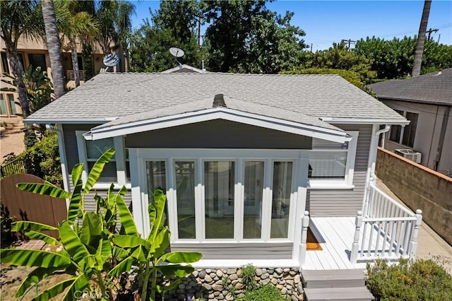 10633 Chiquita St, Toluca Lake, CA 91602 - back of house with roof with shingles and fence