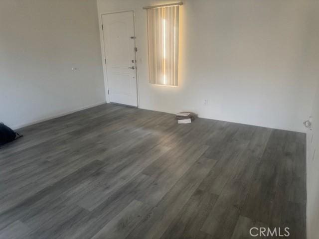 empty room featuring dark wood-style flooring