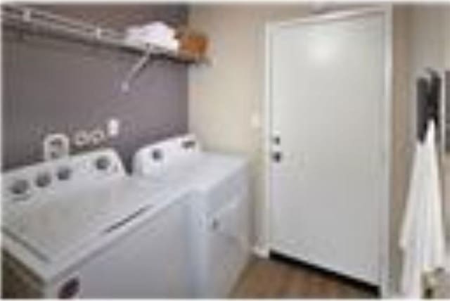 laundry area featuring laundry area and washer and clothes dryer