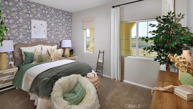 bedroom featuring carpet floors and baseboards