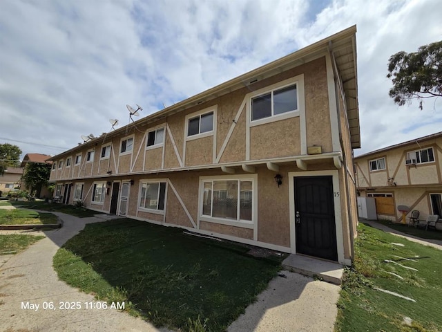 view of front of home featuring stucco siding