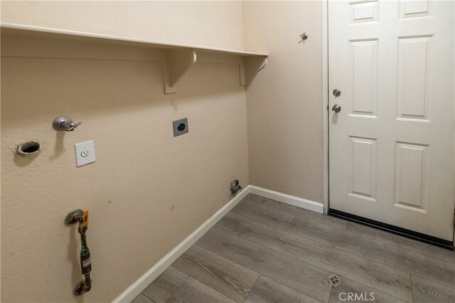 41410 Juniper St Unit 1711, Murrieta, CA 92562 - laundry room with laundry area, wood finished floors, baseboards, and electric dryer hookup