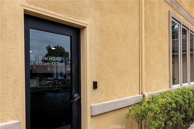 41410 Juniper St Unit 1711, Murrieta, CA 92562 - doorway to property featuring stucco siding