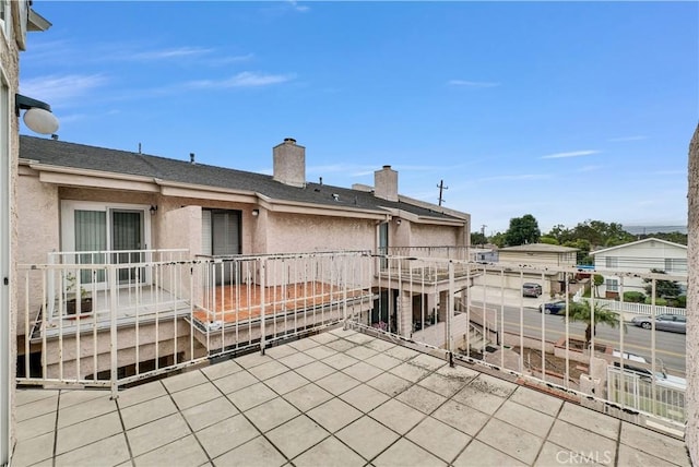 view of patio featuring a balcony
