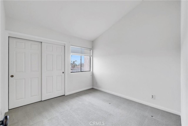 unfurnished bedroom with baseboards, a closet, and carpet floors