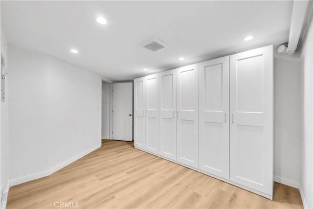 interior space featuring light wood-type flooring, visible vents, baseboards, and recessed lighting