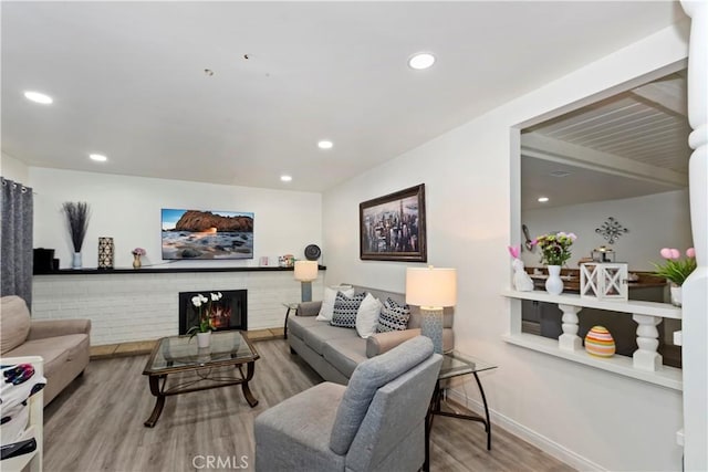 211 E Lurelane St, Rialto, CA 92376 - living area with baseboards, a fireplace, recessed lighting, and wood finished floors