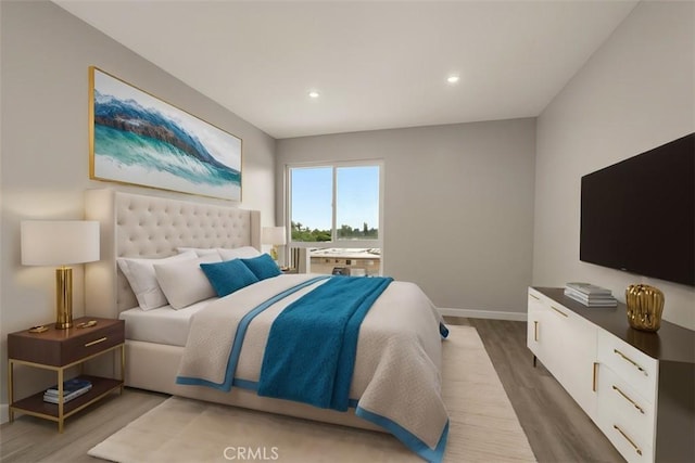 bedroom featuring wood finished floors, baseboards, and recessed lighting