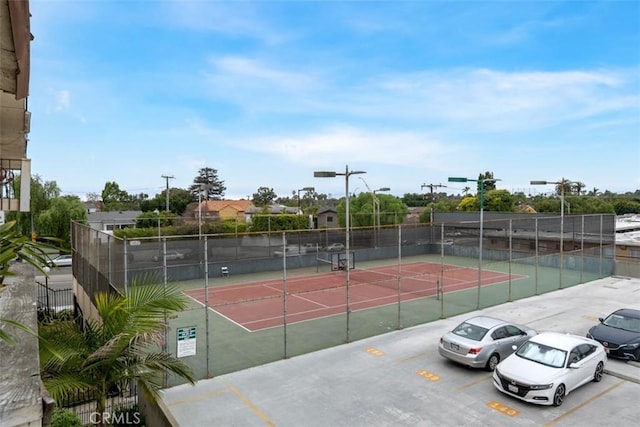 view of sport court with fence