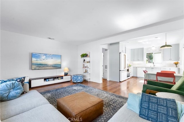 6023 Acacia Ave, Whittier, CA 90601 - living area with wood finished floors
