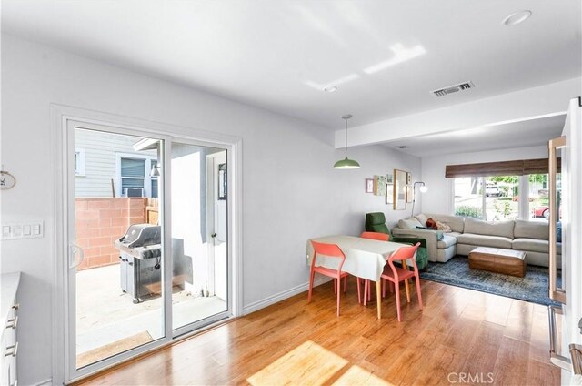6023 Acacia Ave, Whittier, CA 90601 - dining space with light wood-type flooring and baseboards