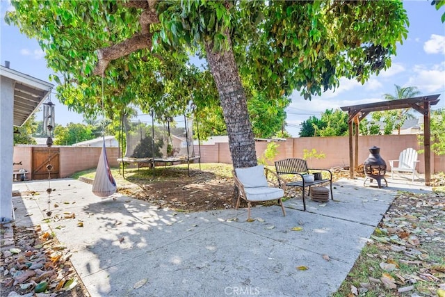 6023 Acacia Ave, Whittier, CA 90601 - view of patio / terrace with a fenced backyard and a trampoline