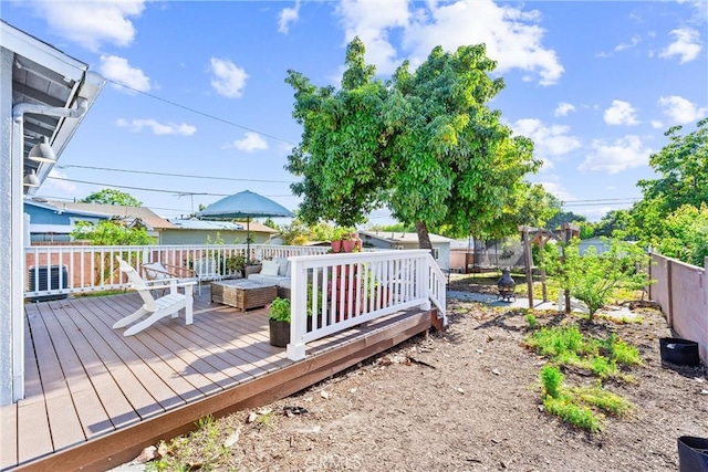 6023 Acacia Ave, Whittier, CA 90601 - wooden deck featuring central AC unit, an outdoor hangout area, and a fenced backyard