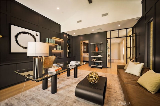 25079 Jim Bridger Rd, Hidden Hills, CA 91302 - living room featuring beamed ceiling, light wood-style floors, visible vents, and high vaulted ceiling