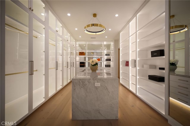 spacious closet featuring light wood-type flooring