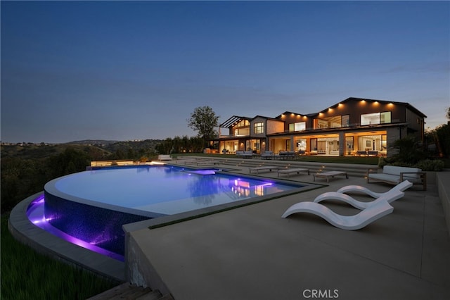 25079 Jim Bridger Rd, Hidden Hills, CA 91302 - view of pool featuring an outdoor hot tub, an infinity pool, and a patio area