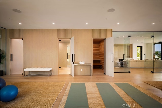 workout area featuring recessed lighting and wood finished floors