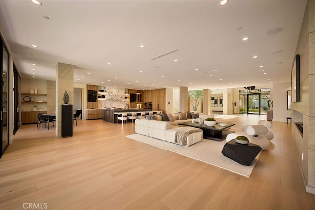 25079 Jim Bridger Rd, Hidden Hills, CA 91302 - living area featuring light wood finished floors and recessed lighting