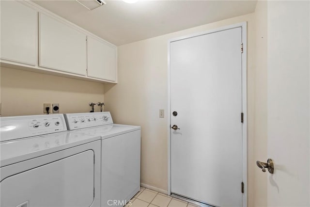 4839 W Forest Oaks Ave, Banning, CA 92220 - laundry room featuring cabinet space, washing machine and clothes dryer, light tile patterned floors, and baseboards