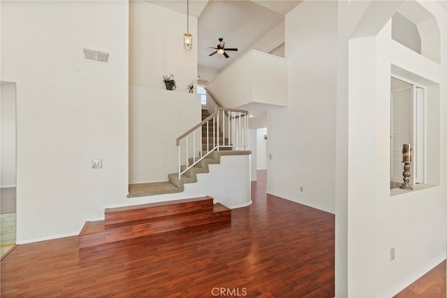 4839 W Forest Oaks Ave, Banning, CA 92220 - entrance foyer with wood finished floors, stairway, a towering ceiling, and a ceiling fan