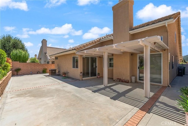 4839 W Forest Oaks Ave, Banning, CA 92220 - back of house featuring stucco siding, a pergola, fence, and a patio area