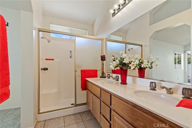 4839 W Forest Oaks Ave, Banning, CA 92220 - bathroom featuring a stall shower, double vanity, and tile patterned flooring