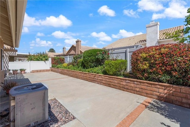 4839 W Forest Oaks Ave, Banning, CA 92220 - view of patio / terrace featuring central air condition unit and a fenced backyard