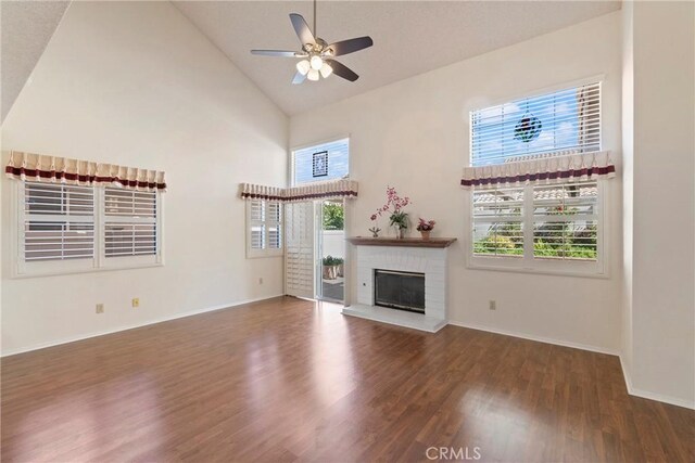 4839 W Forest Oaks Ave, Banning, CA 92220 - unfurnished living room with high vaulted ceiling, wood finished floors, ceiling fan, baseboards, and plenty of natural light