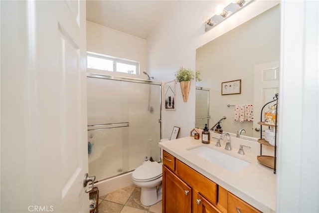 full bath featuring tile patterned floors, toilet, a shower stall, and vanity