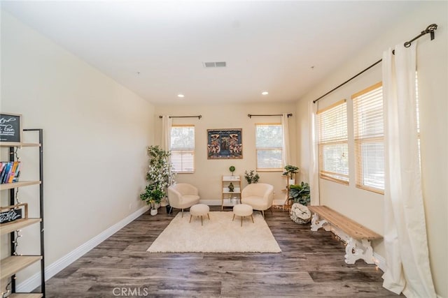 sitting room featuring visible vents, wood finished floors, baseboards, and recessed lighting