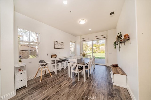 dining space with visible vents, wood finished floors, baseboards, and recessed lighting