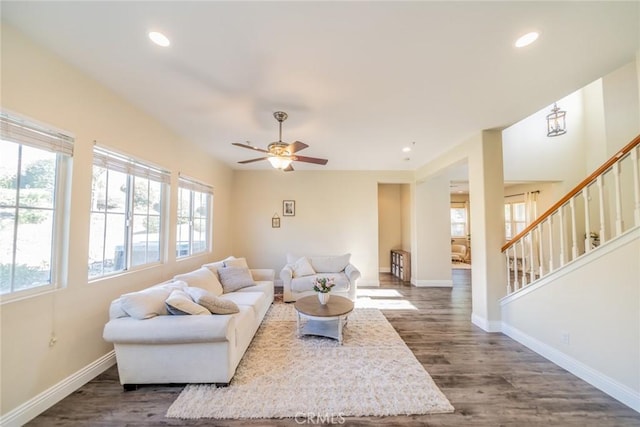 living room featuring stairs, baseboards, ceiling fan, dark wood-style floors, and recessed lighting