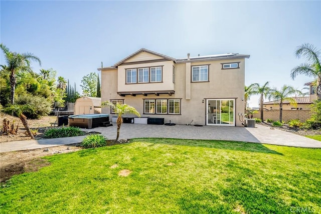 back of property with central AC, a patio, stucco siding, and fence