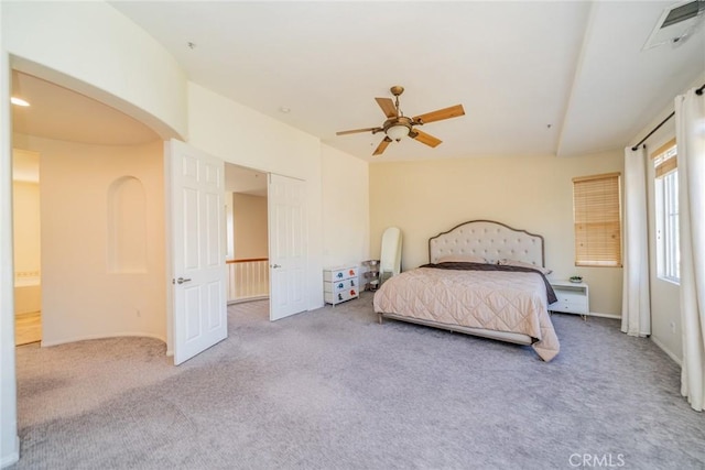 bedroom with carpet flooring, visible vents, baseboards, and ceiling fan