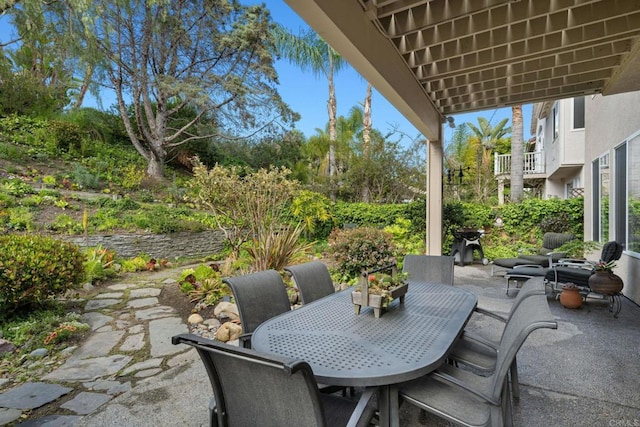 view of patio featuring outdoor dining area