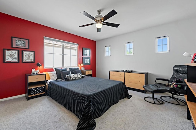 bedroom featuring carpet flooring, baseboards, and a ceiling fan