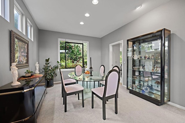 carpeted dining space featuring a wealth of natural light, baseboards, and recessed lighting