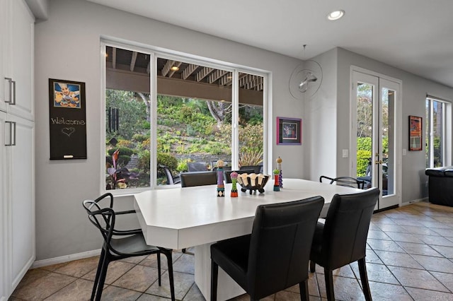 dining area with baseboards and recessed lighting