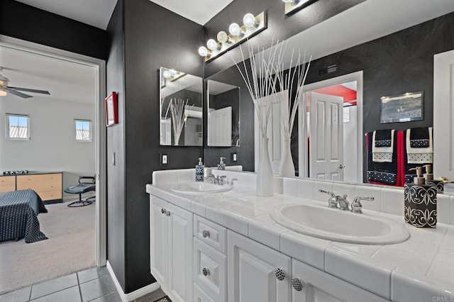 5054 Seachase Way, San Diego, CA 92130 - ensuite bathroom with double vanity, ceiling fan, and tile patterned flooring