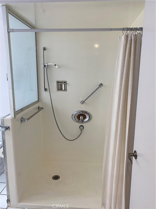 full bathroom with a shower stall