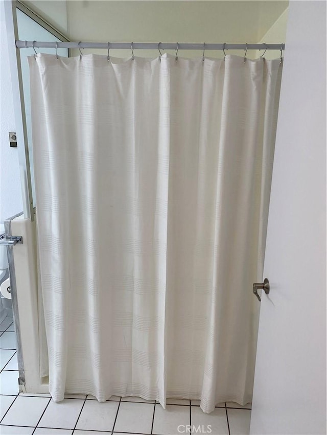 bathroom with tile patterned floors