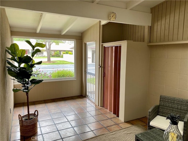 interior space featuring beam ceiling
