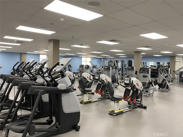exercise room with a paneled ceiling