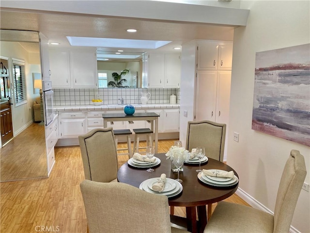 13310 Fairfield Ln Unit M7-176B, Seal Beach, CA 90740 - dining room with light wood-style floors and baseboards