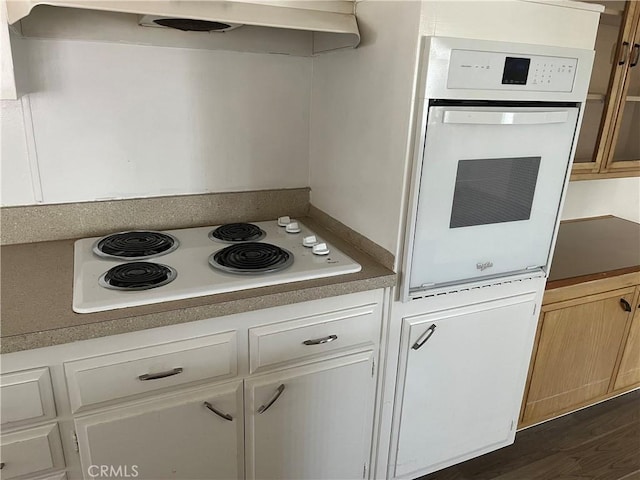 28960 Olympia Way, Menifee, CA 92586 - kitchen featuring white appliances, under cabinet range hood, and dark wood-style flooring