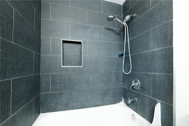 bathroom featuring washtub / shower combination
