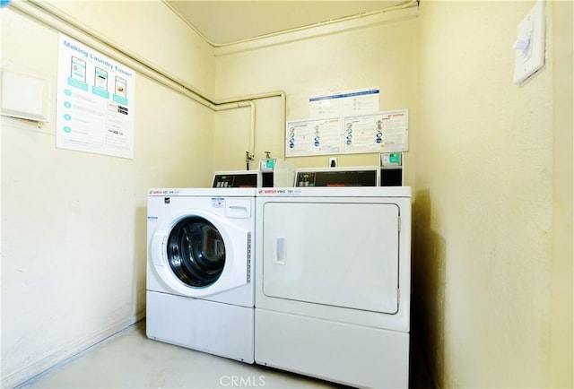 shared laundry area featuring washer and clothes dryer